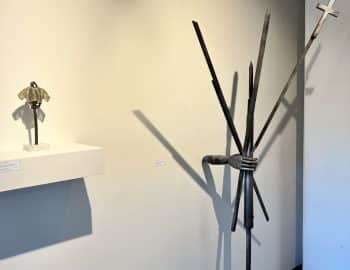 A group of sculptures on display in an art gallery.