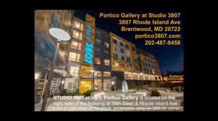 Nighttime view of the portico gallery & studio 3807 building entrance, illuminated by lights, with a visible address and phone number.